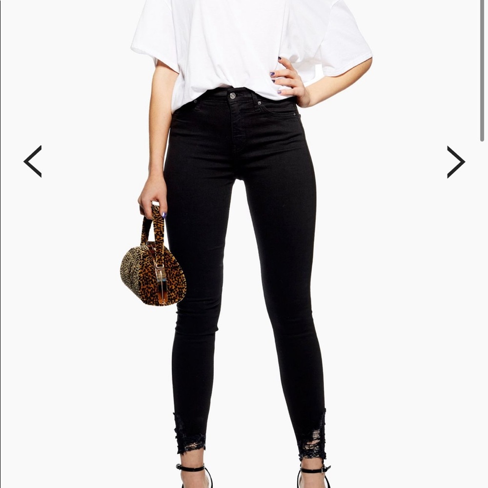 Topshop black ripped hem Jamie jeans